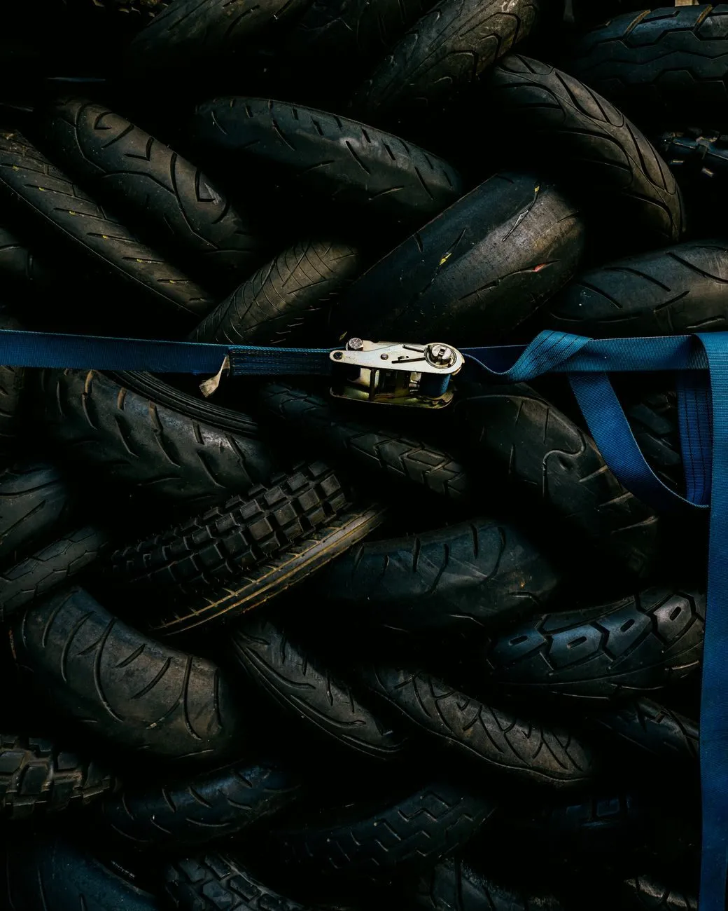 A pile of used tyres strapped together in the tyre store